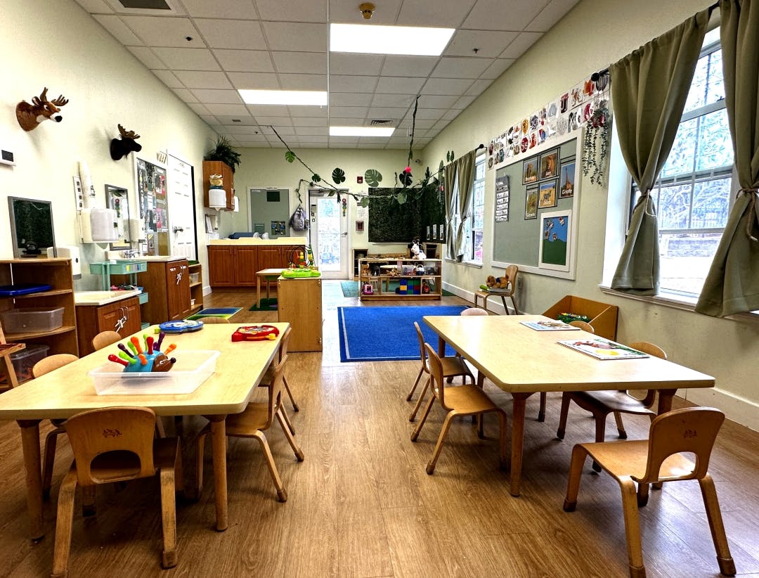 Empty classroom with small tables and chairs
