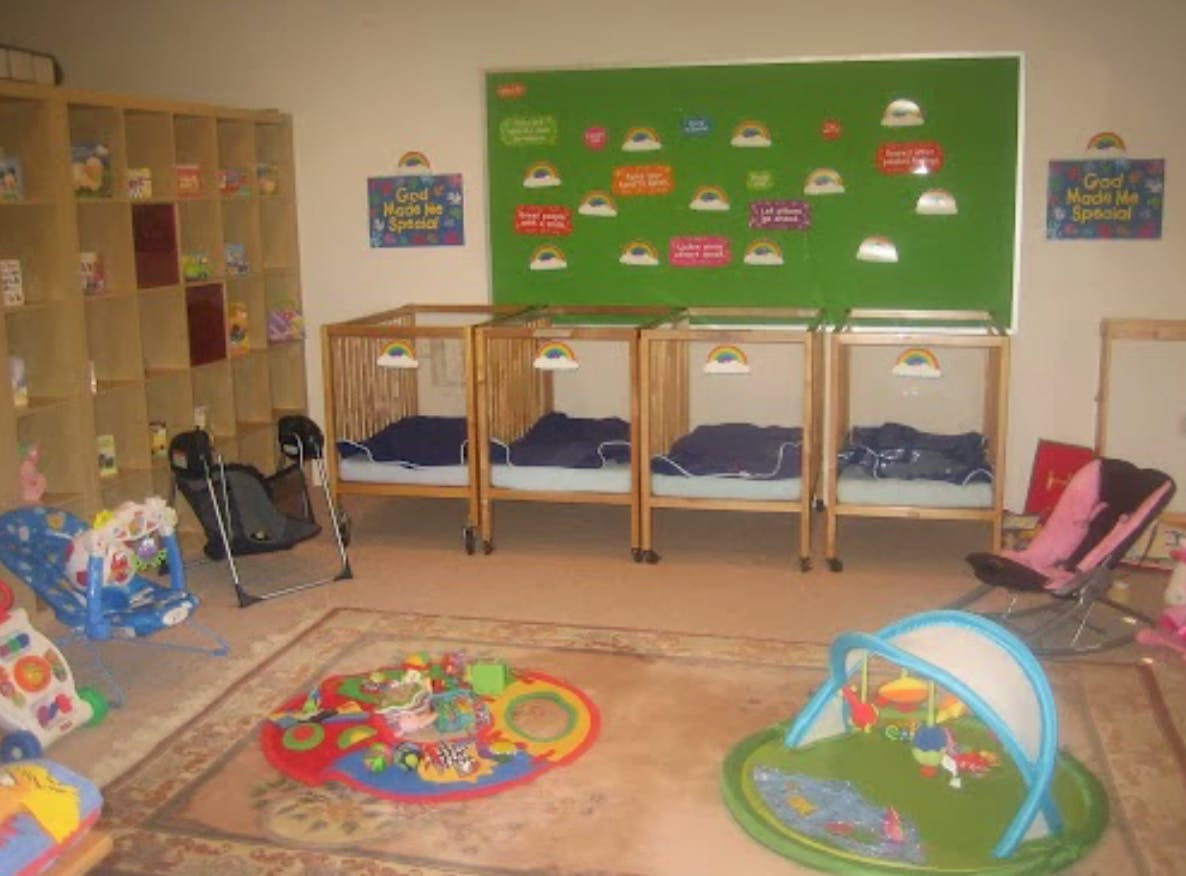 Nursery room with multiple cribs and playmats