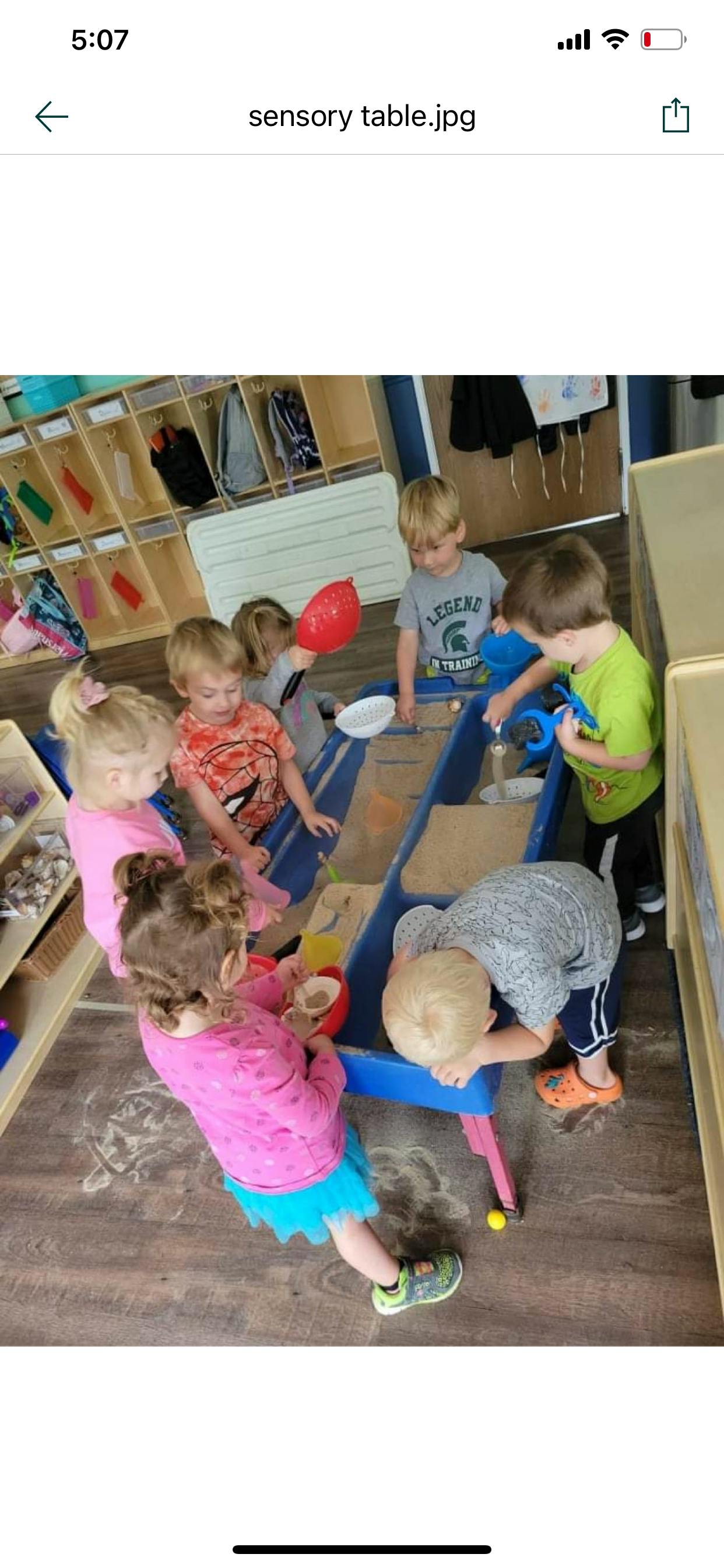 Children playing at a sensory table