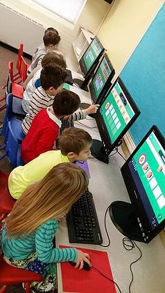 Children using computers in a classroom