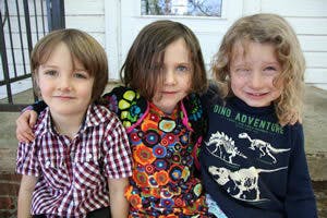 Three children sitting together