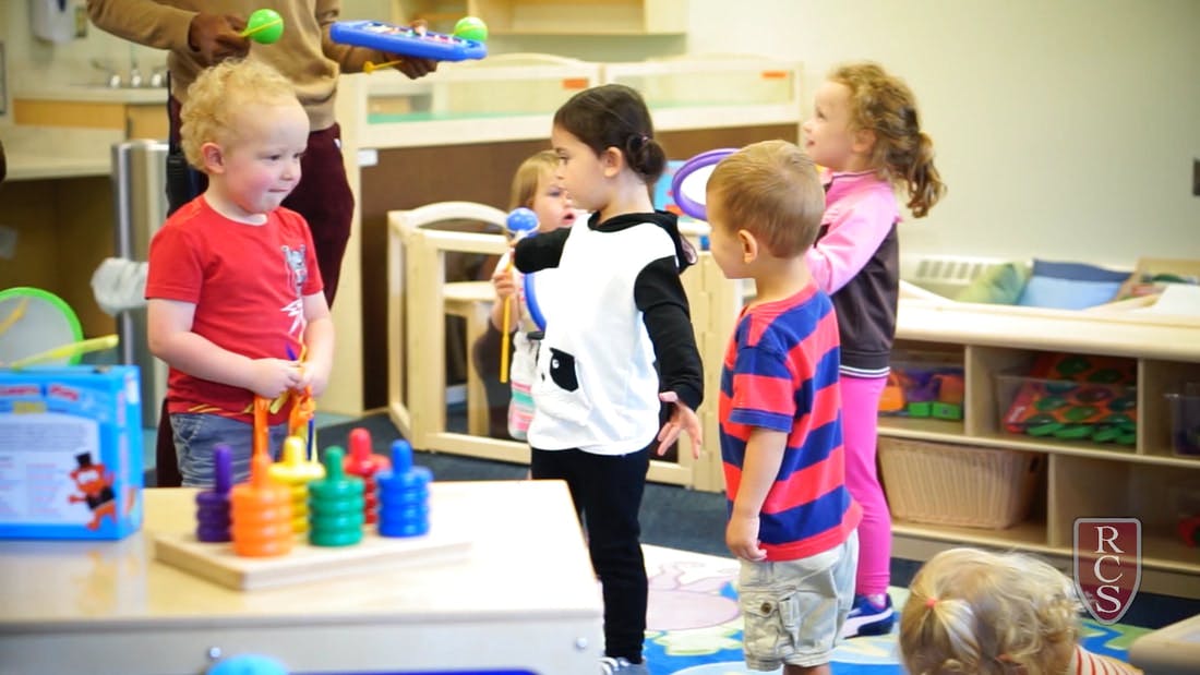 Children playing with toys in a classroom