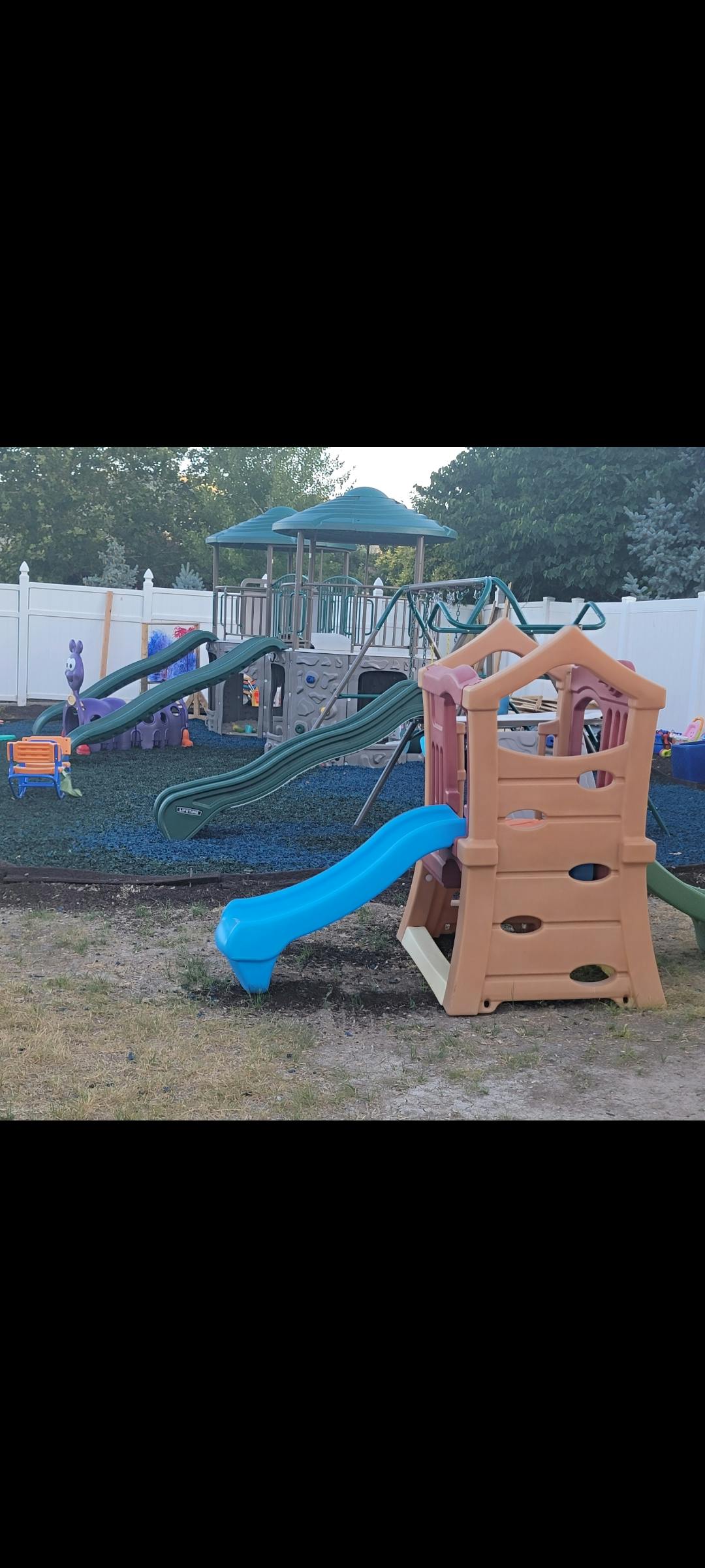 Playground with multiple slides and climbing structures