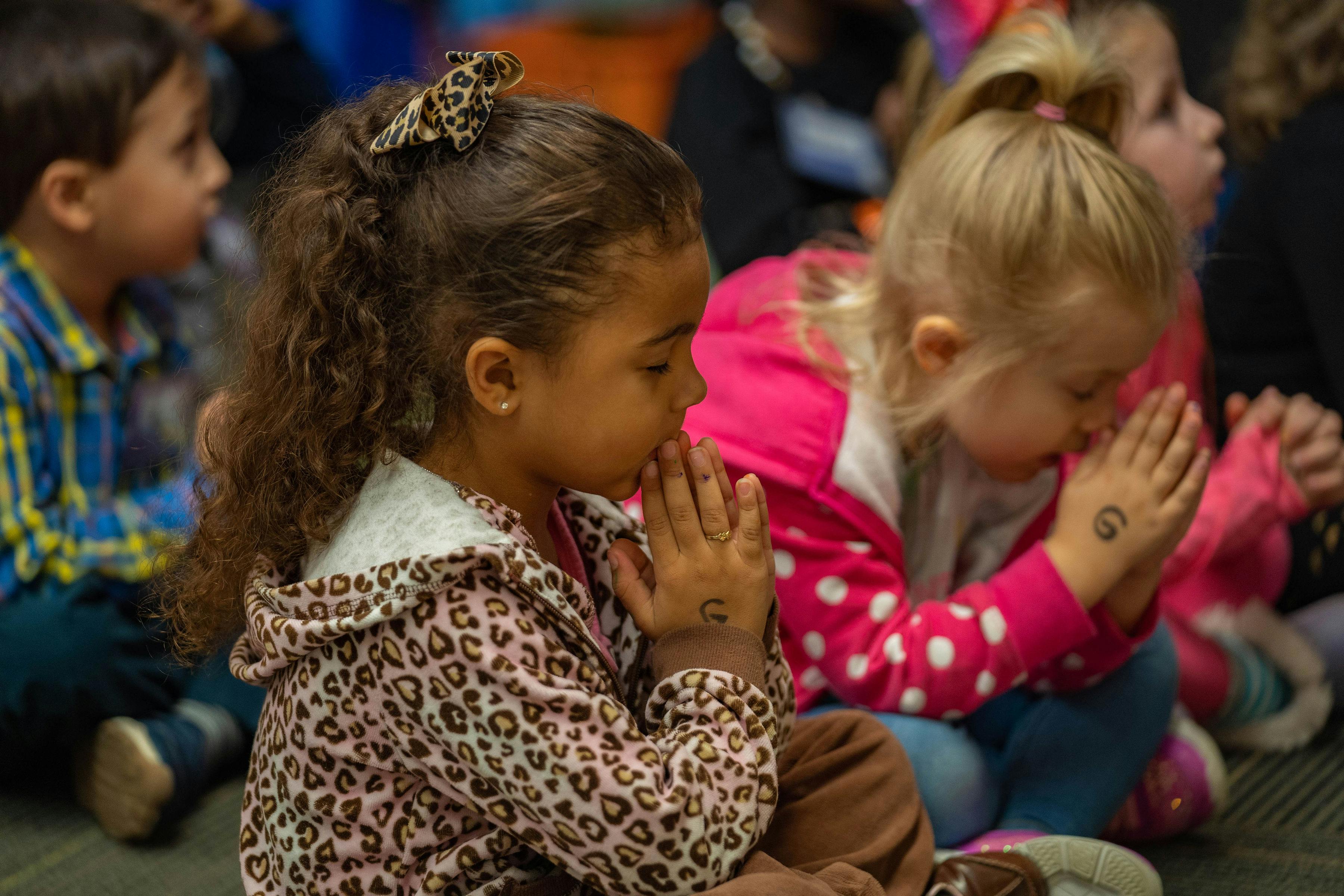 Two children with hands together