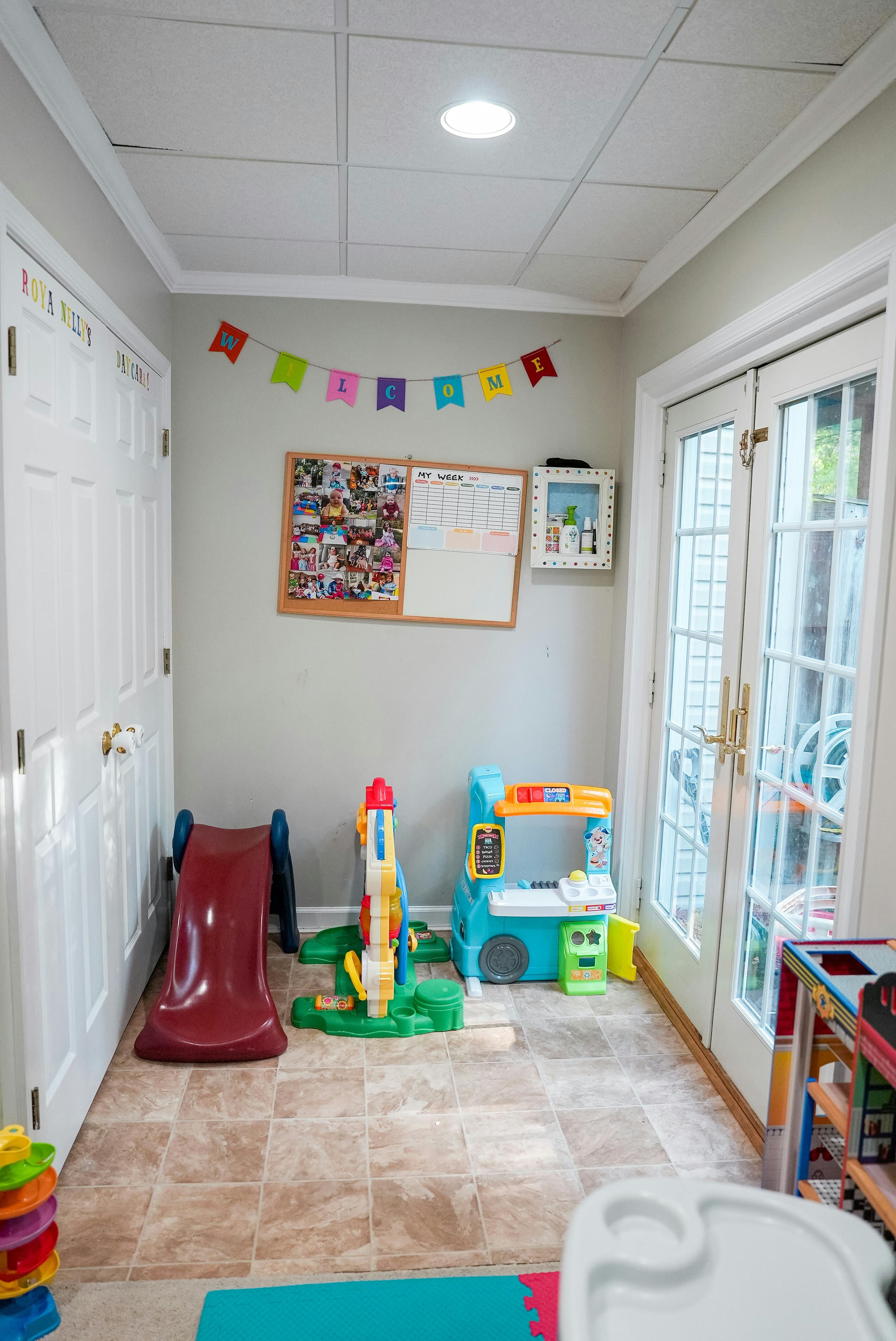 Playroom with a red slide and other colorful toys