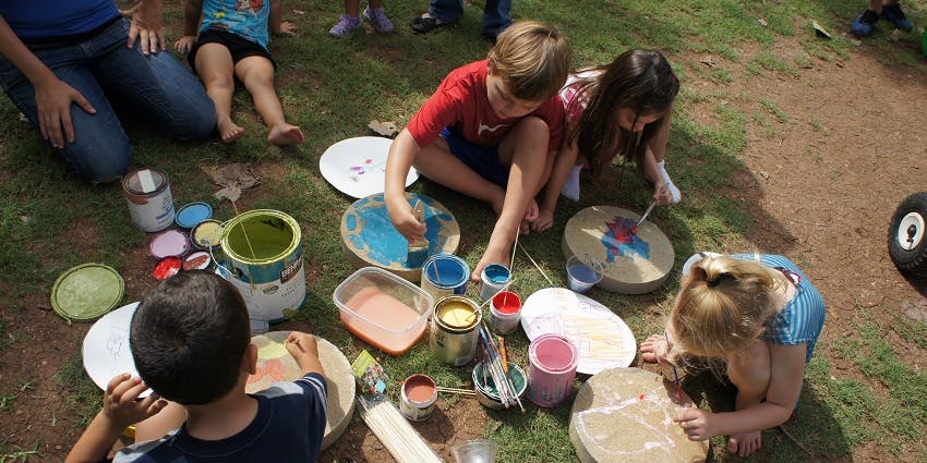 Children painting outdoors