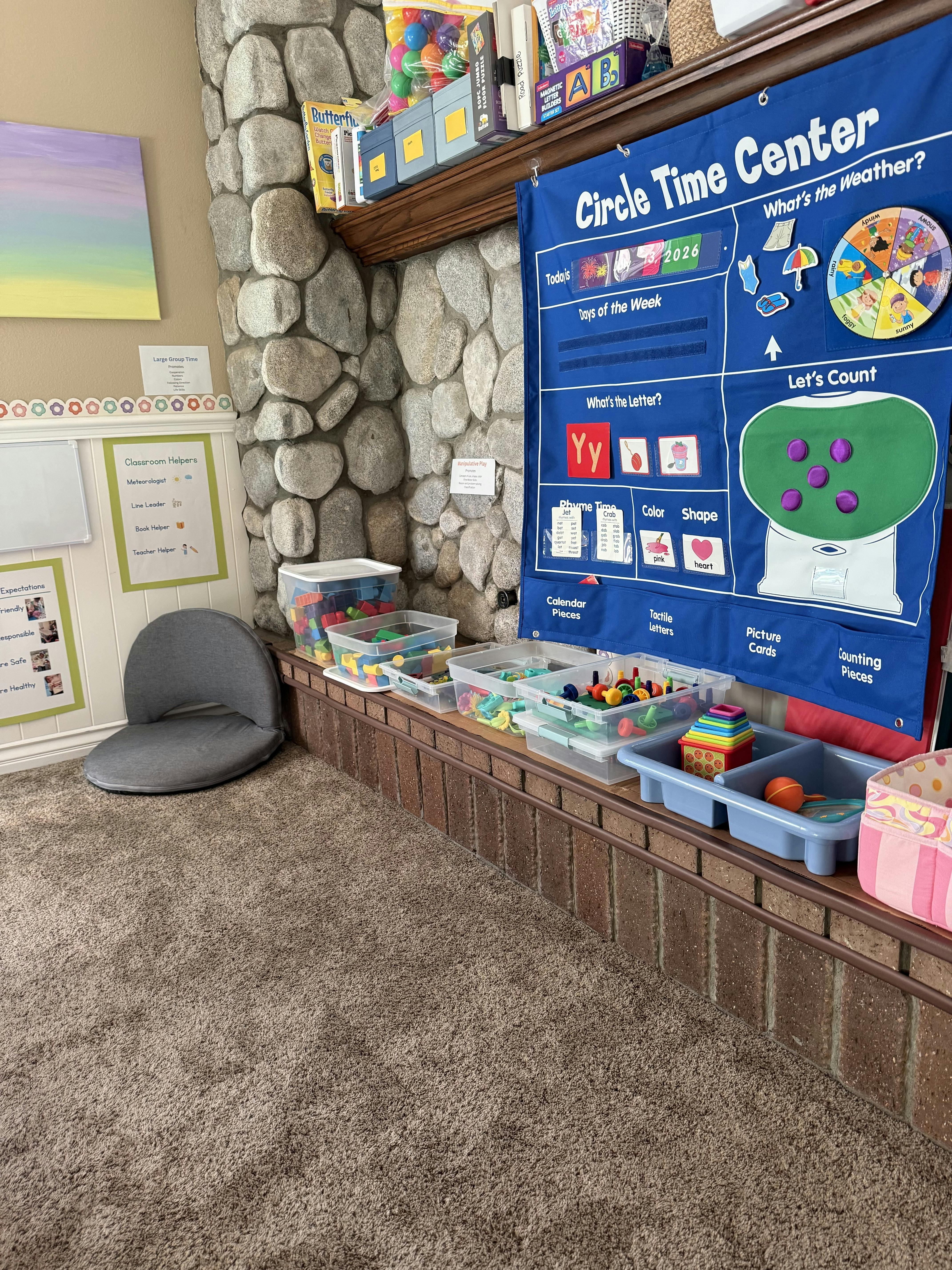 Classroom circle time calendar with educational toys in bins