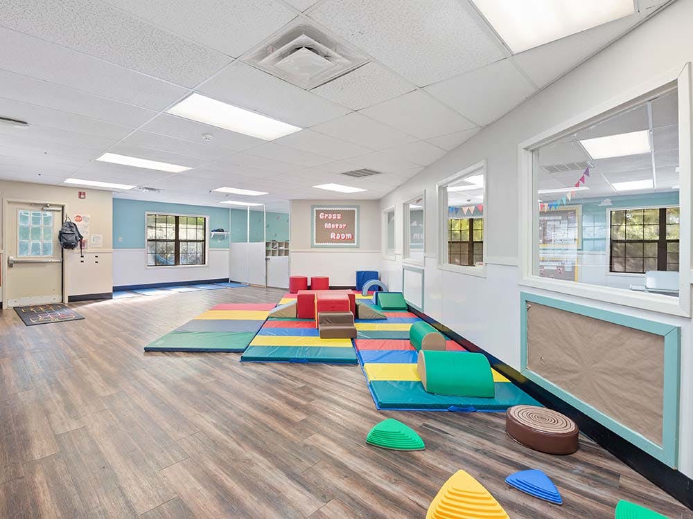 Empty children's playroom with colorful soft play equipment
