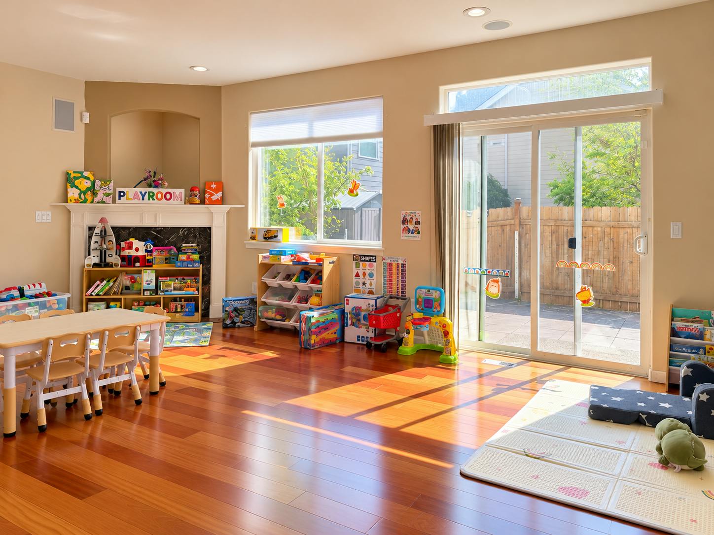 Sunny playroom with a table, chairs, storage shelves, and toys