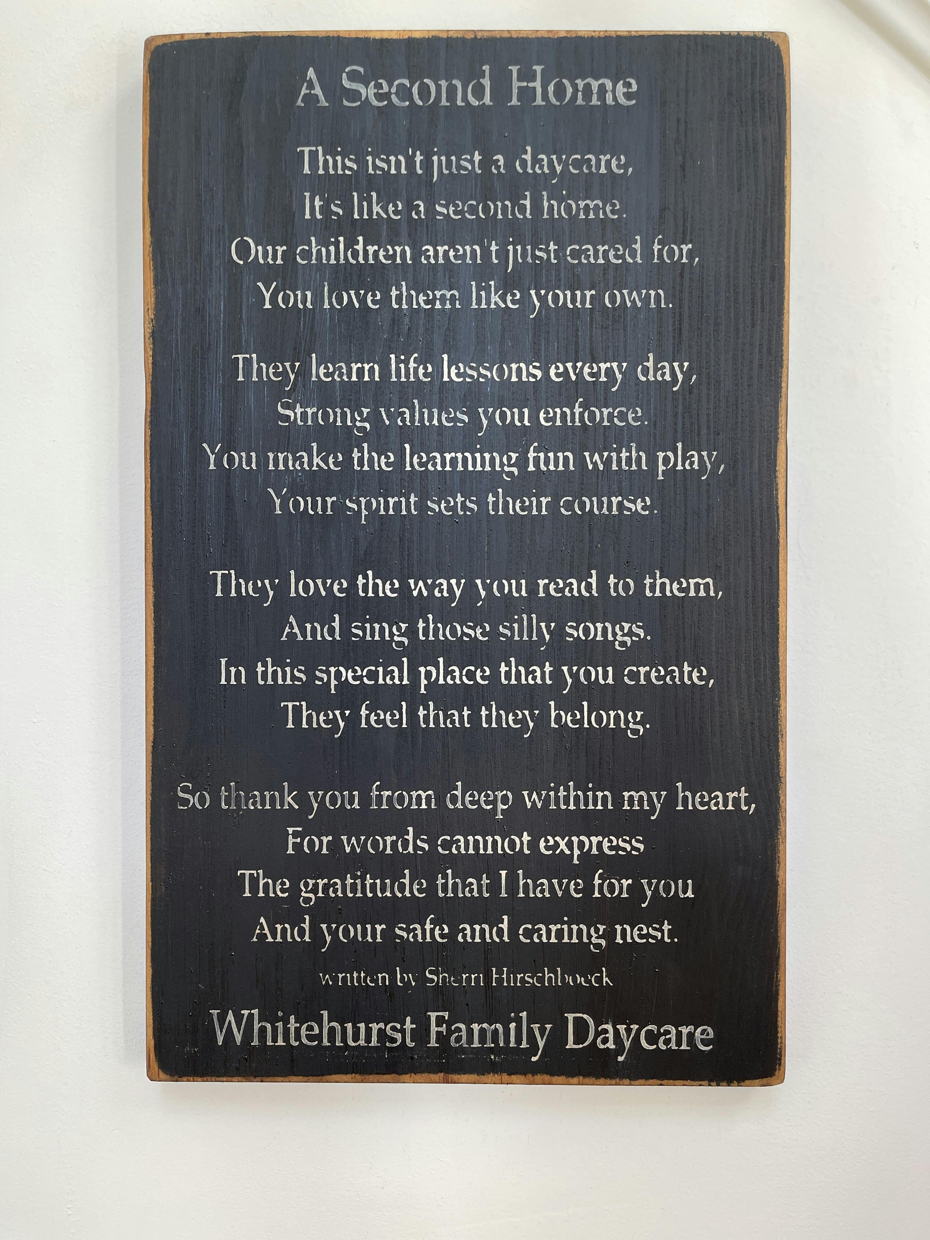 Wooden sign with the poem A Second Home for Whitehurst Family Daycare