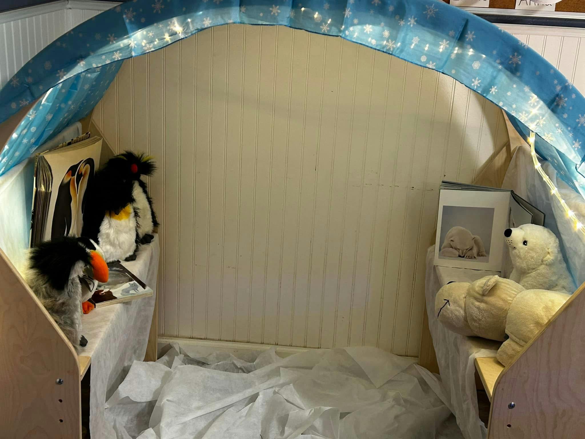 Play tent with stuffed penguins and polar bears