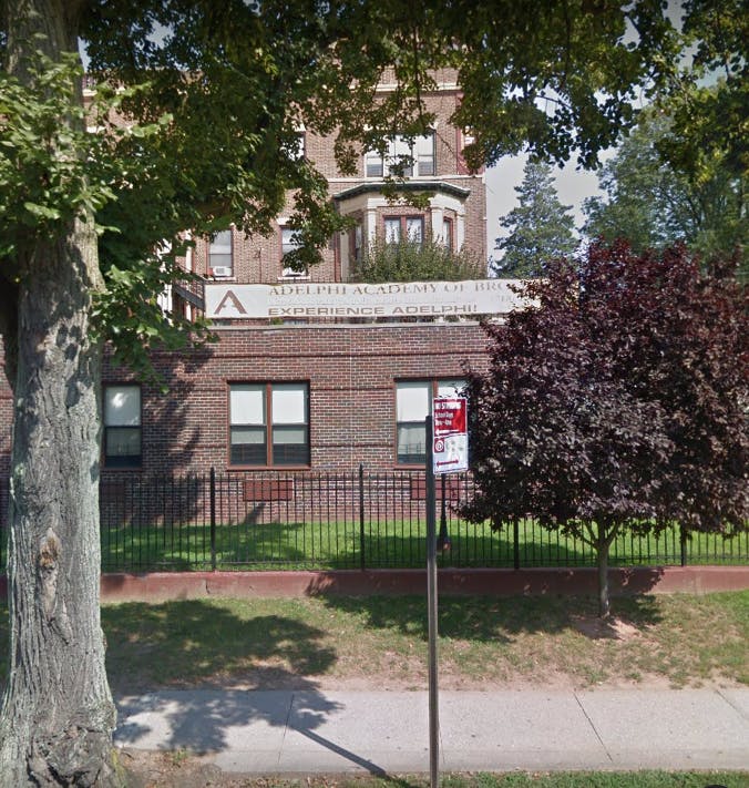 Brick building with a sign that reads "ACADEMY"
