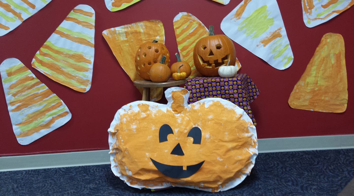 Halloween decorations with pumpkins and candy corn cutouts