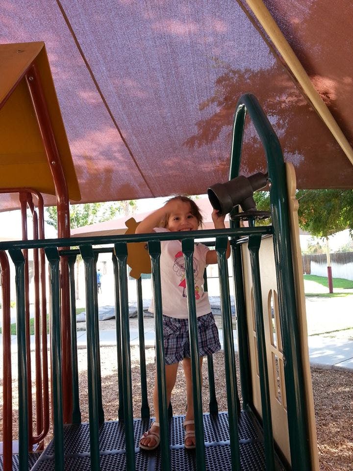 Child on a playground structure