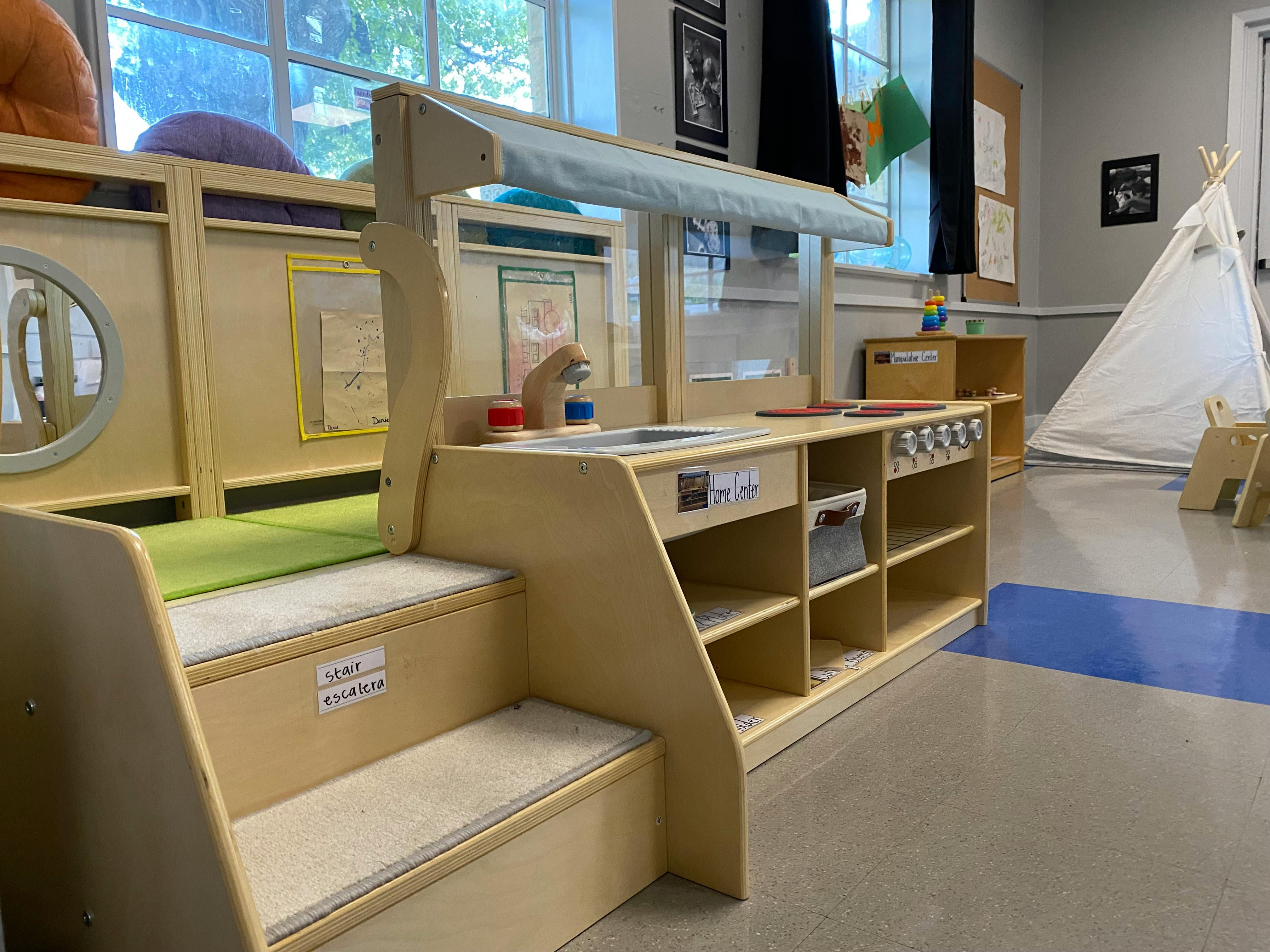 Play kitchen and steps in a classroom