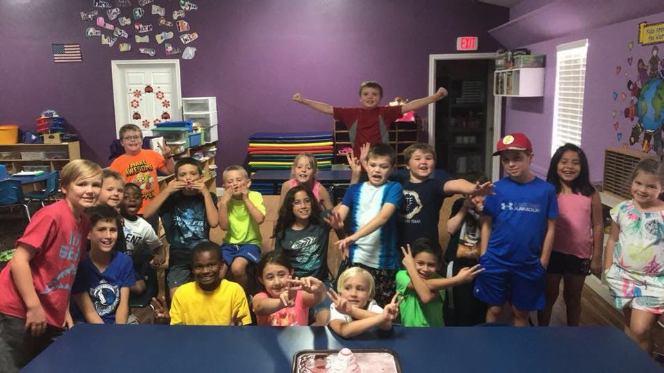 Group of children posing in a room