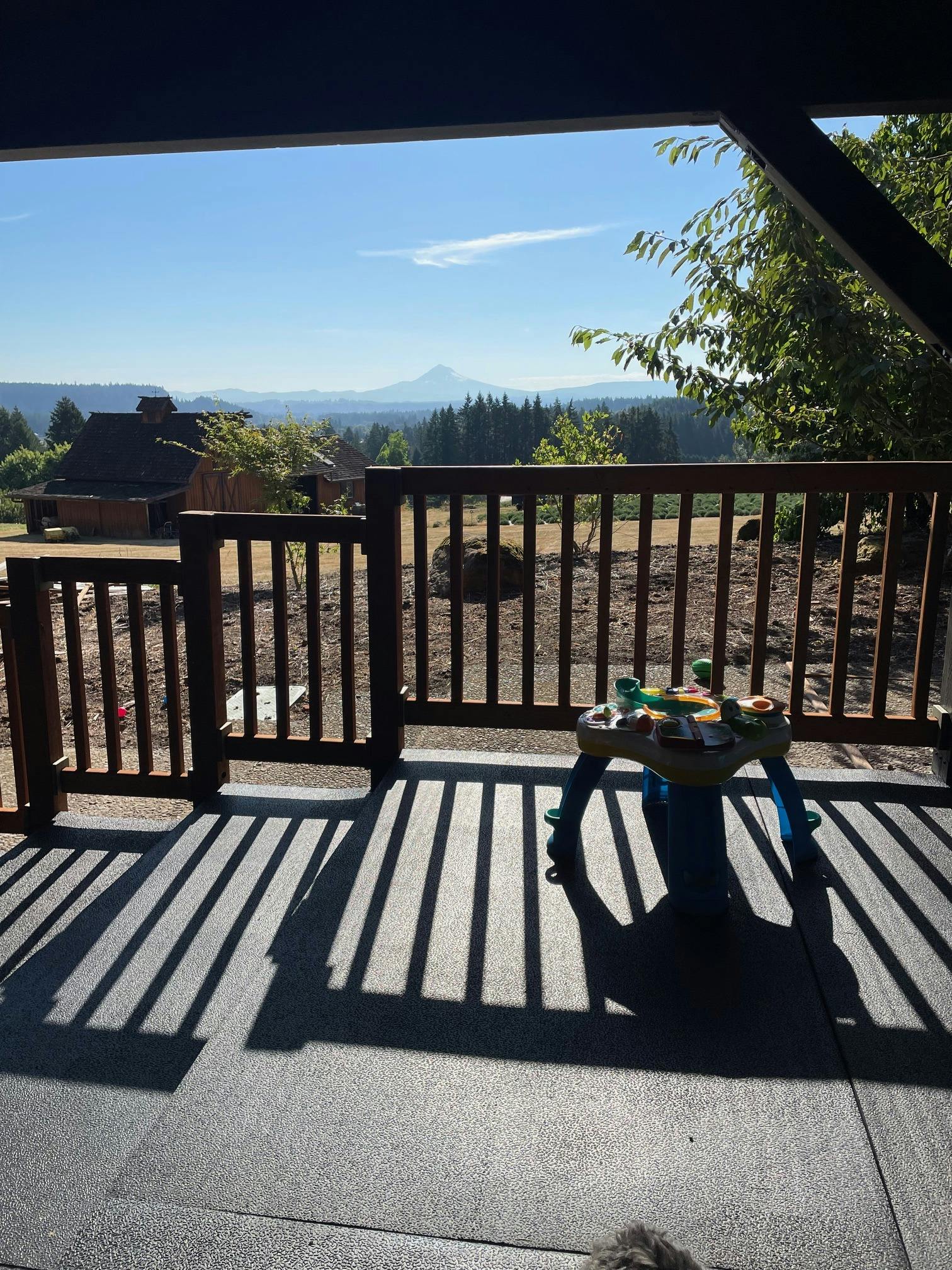 Deck with a mountain view and a child's activity table