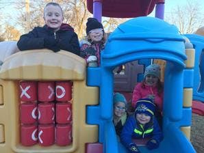 Multiple children on a playground structure