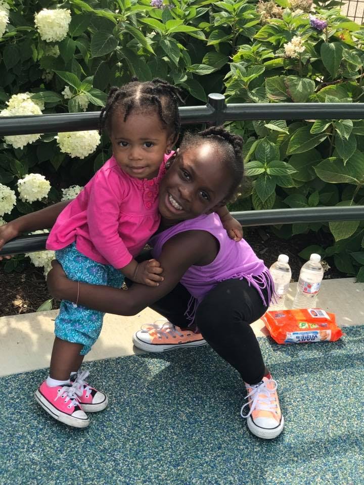 Child holding another child