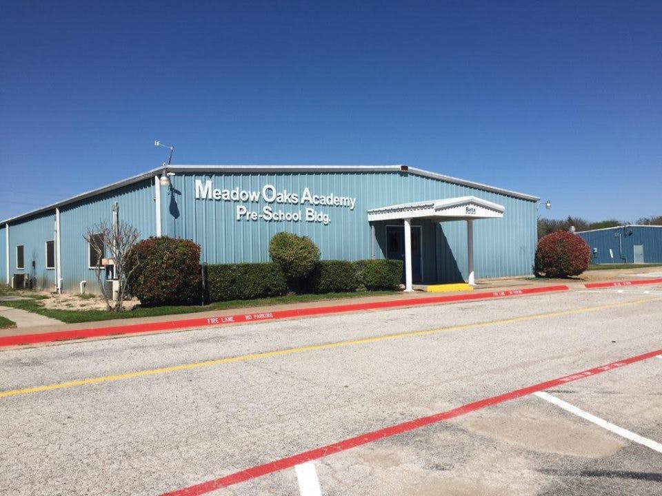 Meadow Oaks Academy Pre-School Bldg on a blue building