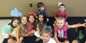 Group of children sitting on the floor