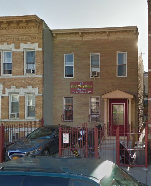 Building with a sign that reads "Pinks Tiny Home"