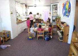 children and adults in a classroom