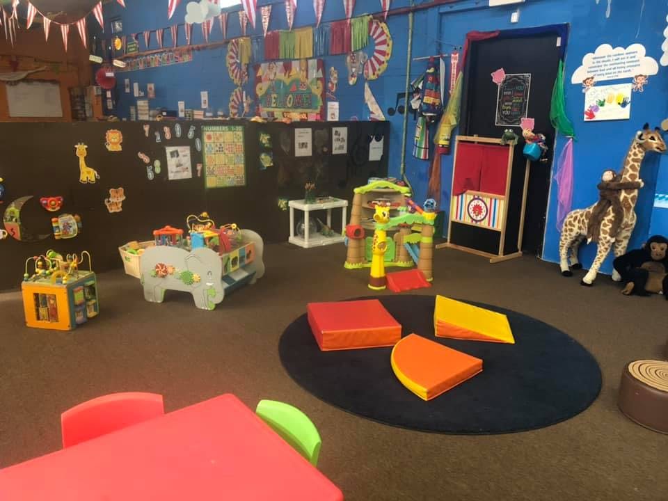 Playroom with various toys and a small table