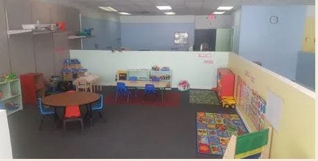 Playroom with small tables and chairs