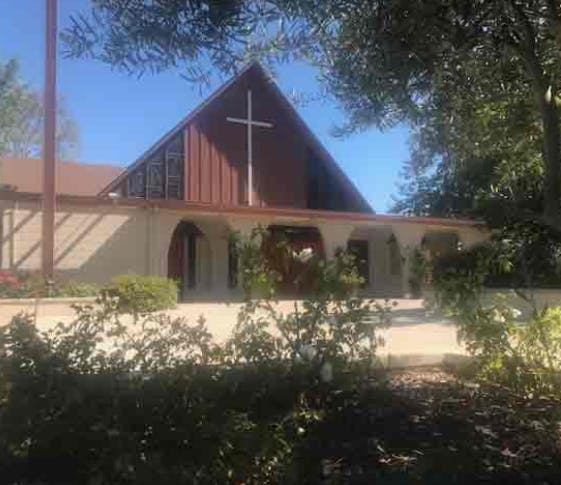 Church building with a cross on the front gable