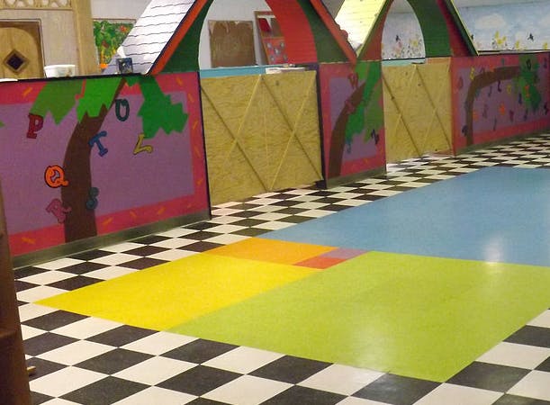 Play area with colorful walls and checkered floor