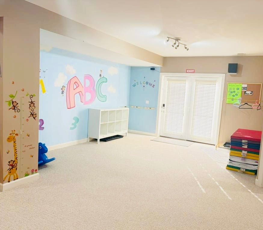 Playroom with ABCs and other decorations on the wall