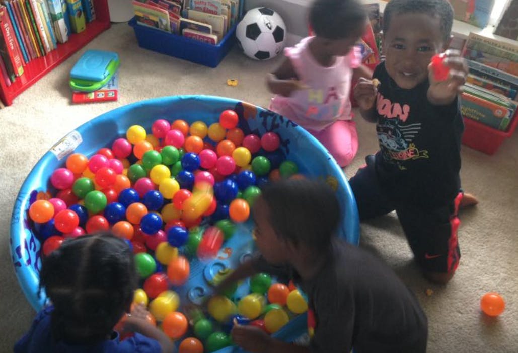 Children playing in a ball pit