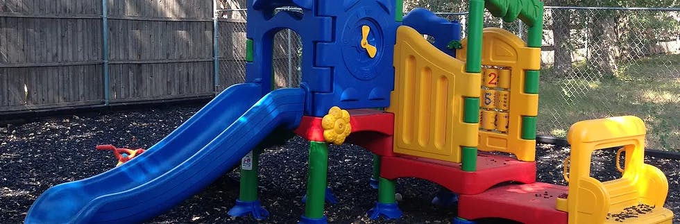 Colorful playground slide and climbing structure