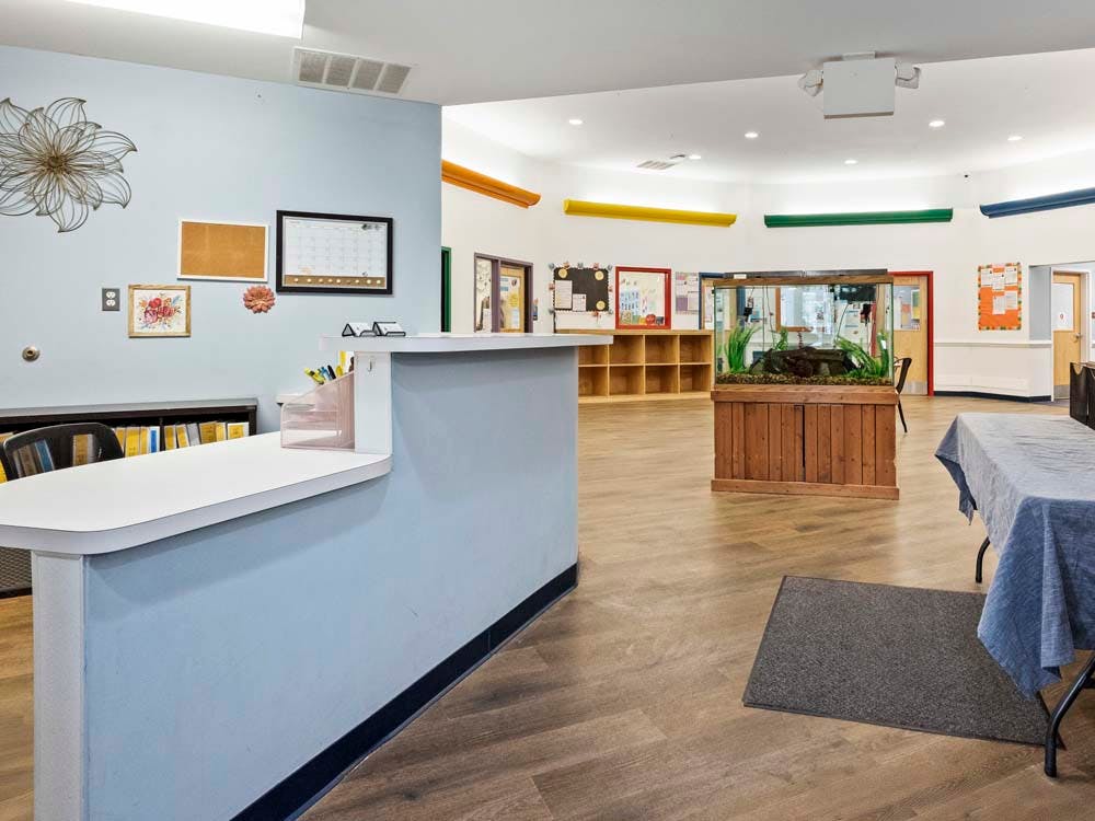 Reception desk with a fish tank in the background