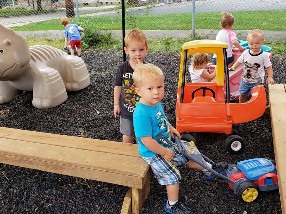 Children playing with toys outdoors