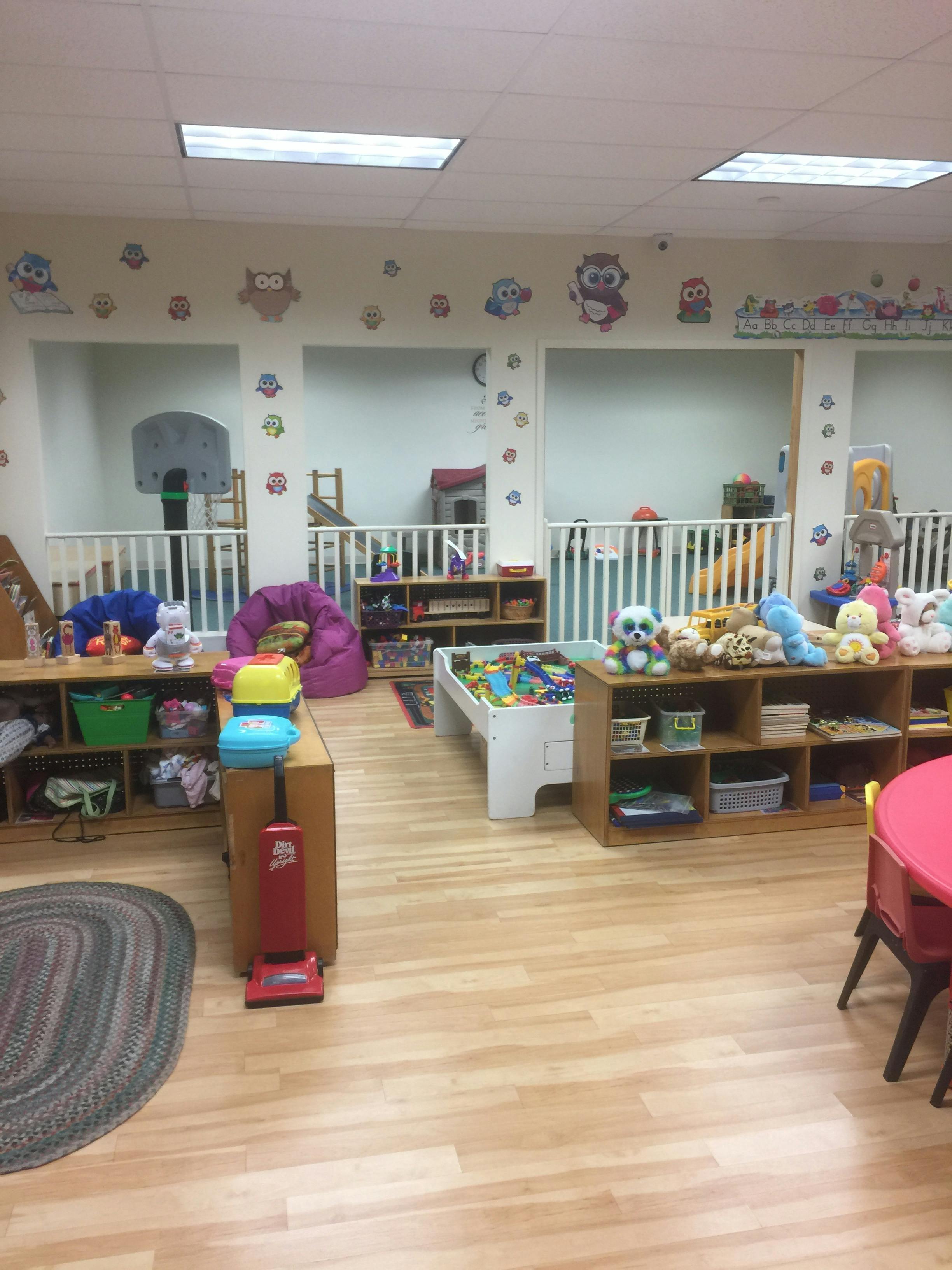 Playroom with toys, shelves, and a ball pit