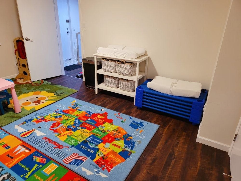 Children's room with a map rug and changing table