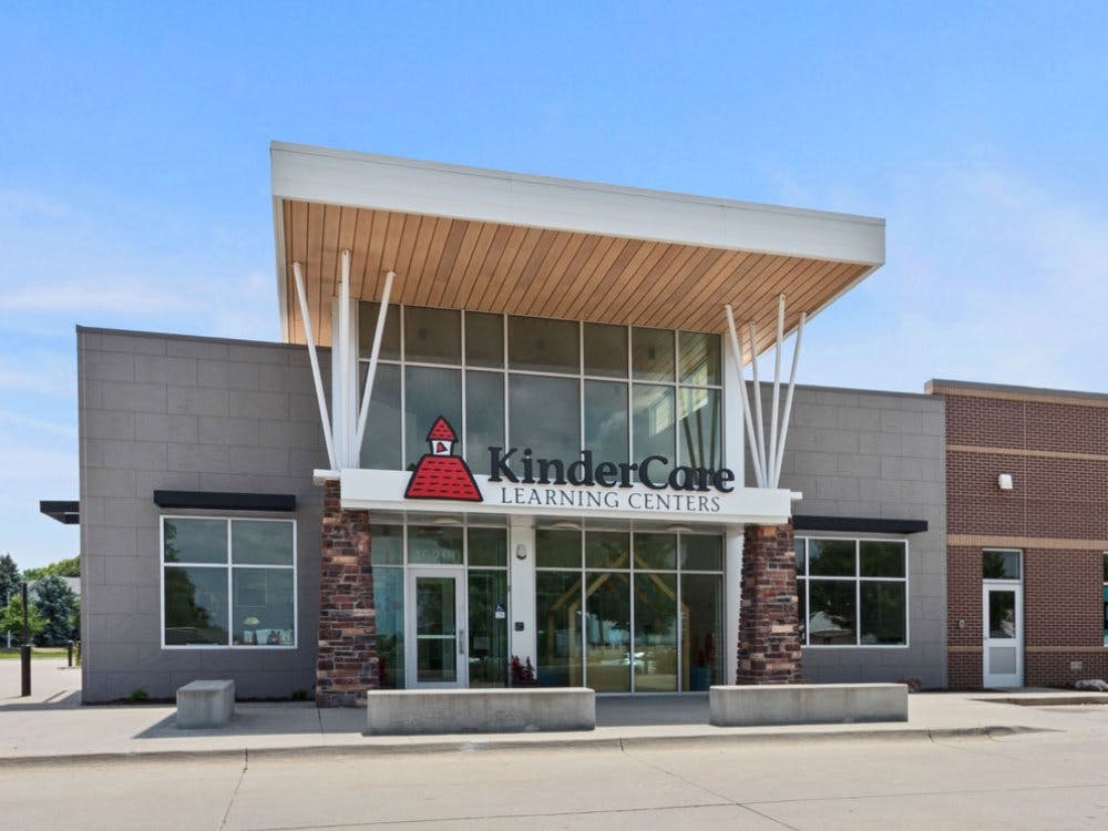 KinderCare Learning Centers building with a red schoolhouse logo