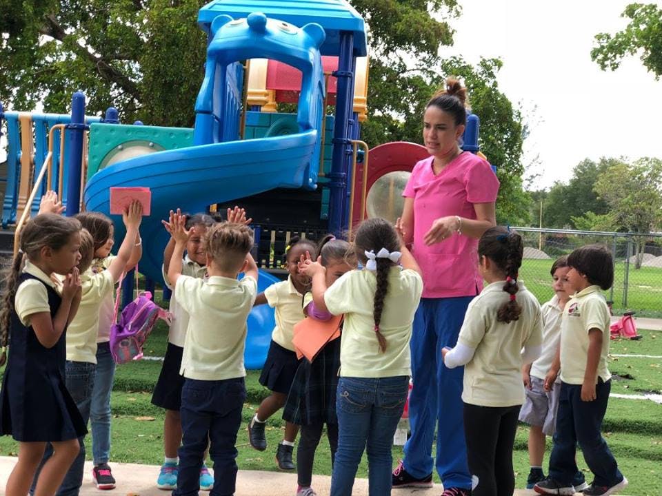 Person with children on a playground