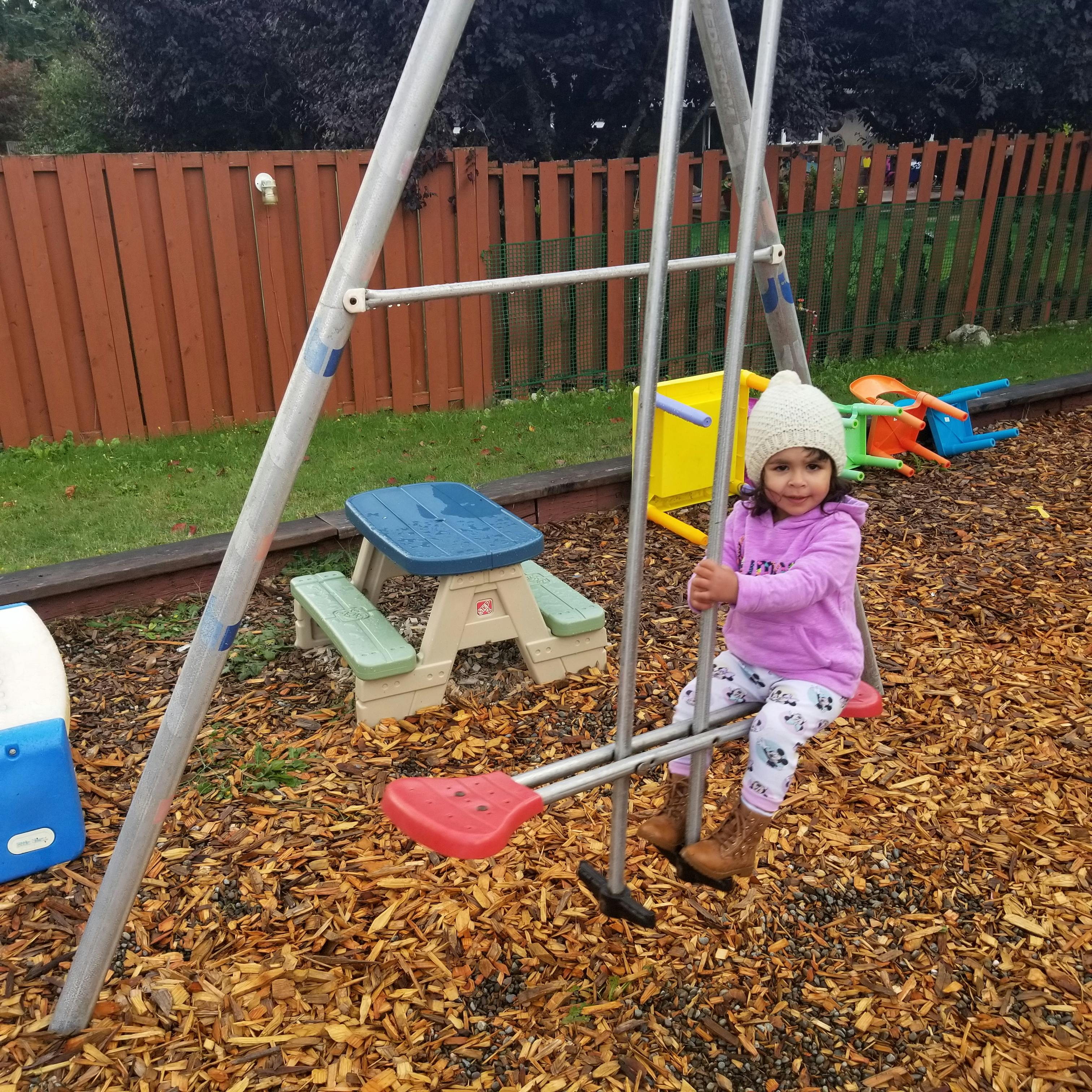 Child on a swing set