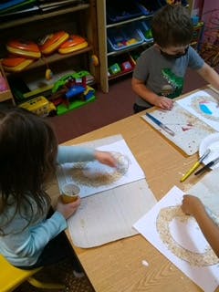 Children doing crafts at a table