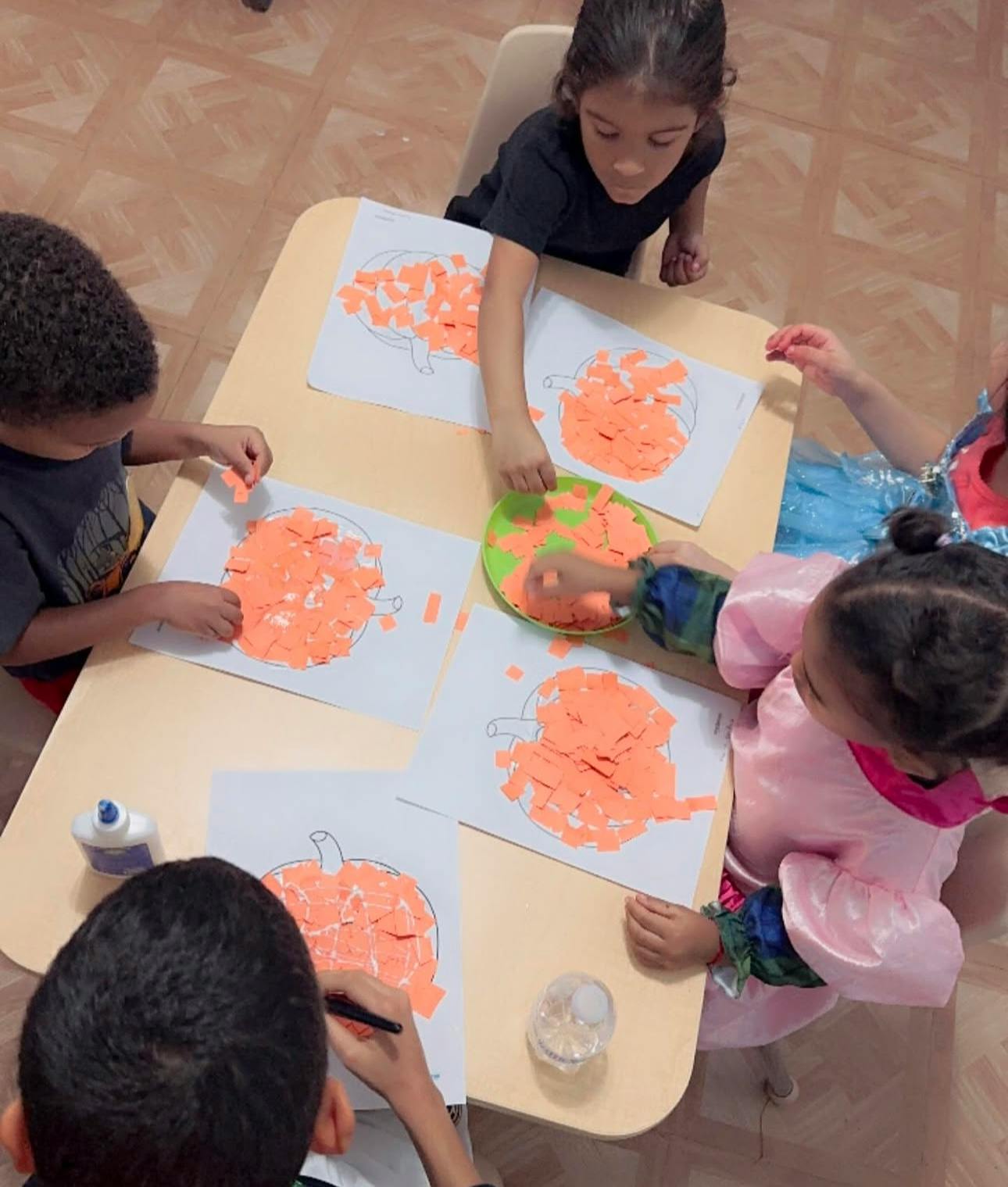 Children doing crafts at a table