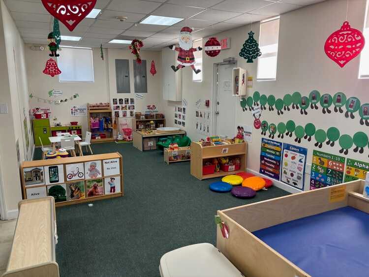 Classroom decorated with holiday ornaments and caterpillar cutouts