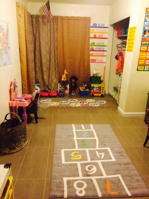Playroom with hopscotch rug and learning materials
