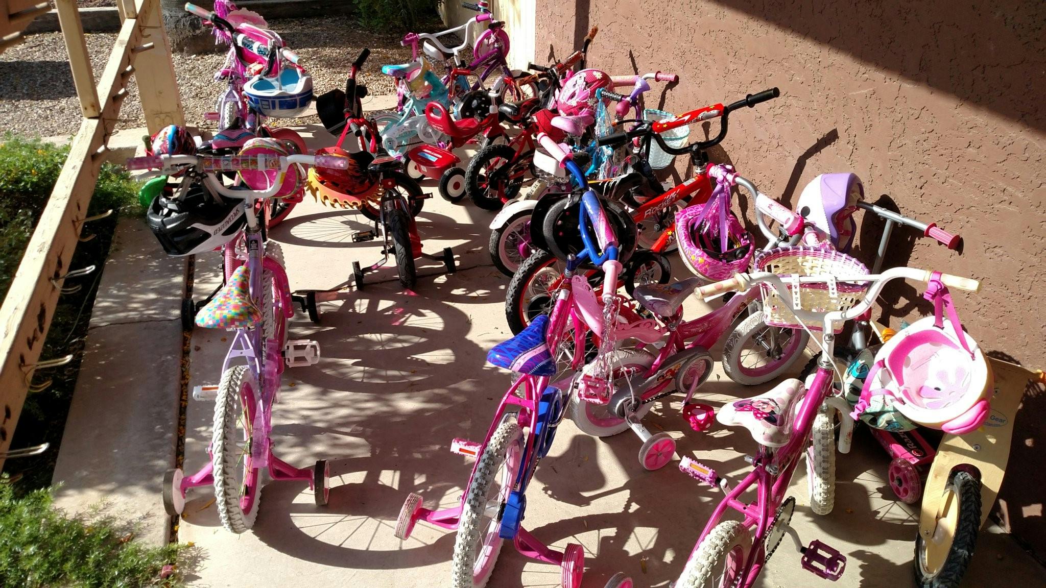 Group of children's bicycles parked outdoors