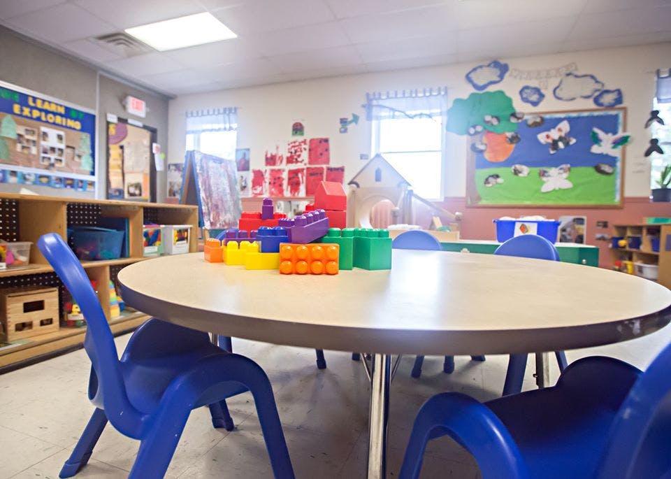 Classroom with small table and chairs, building blocks on table