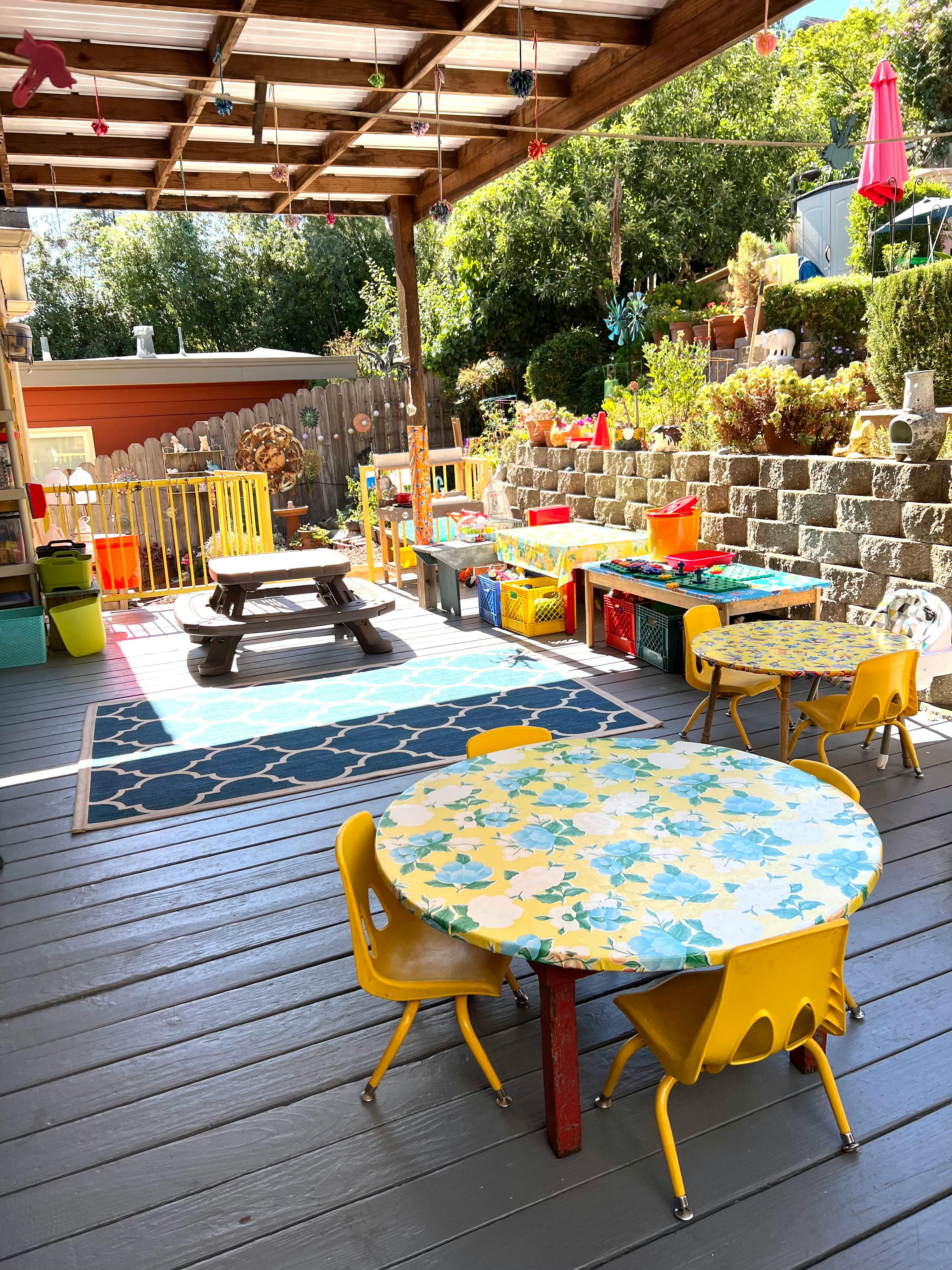 Outdoor patio with small tables and chairs for children