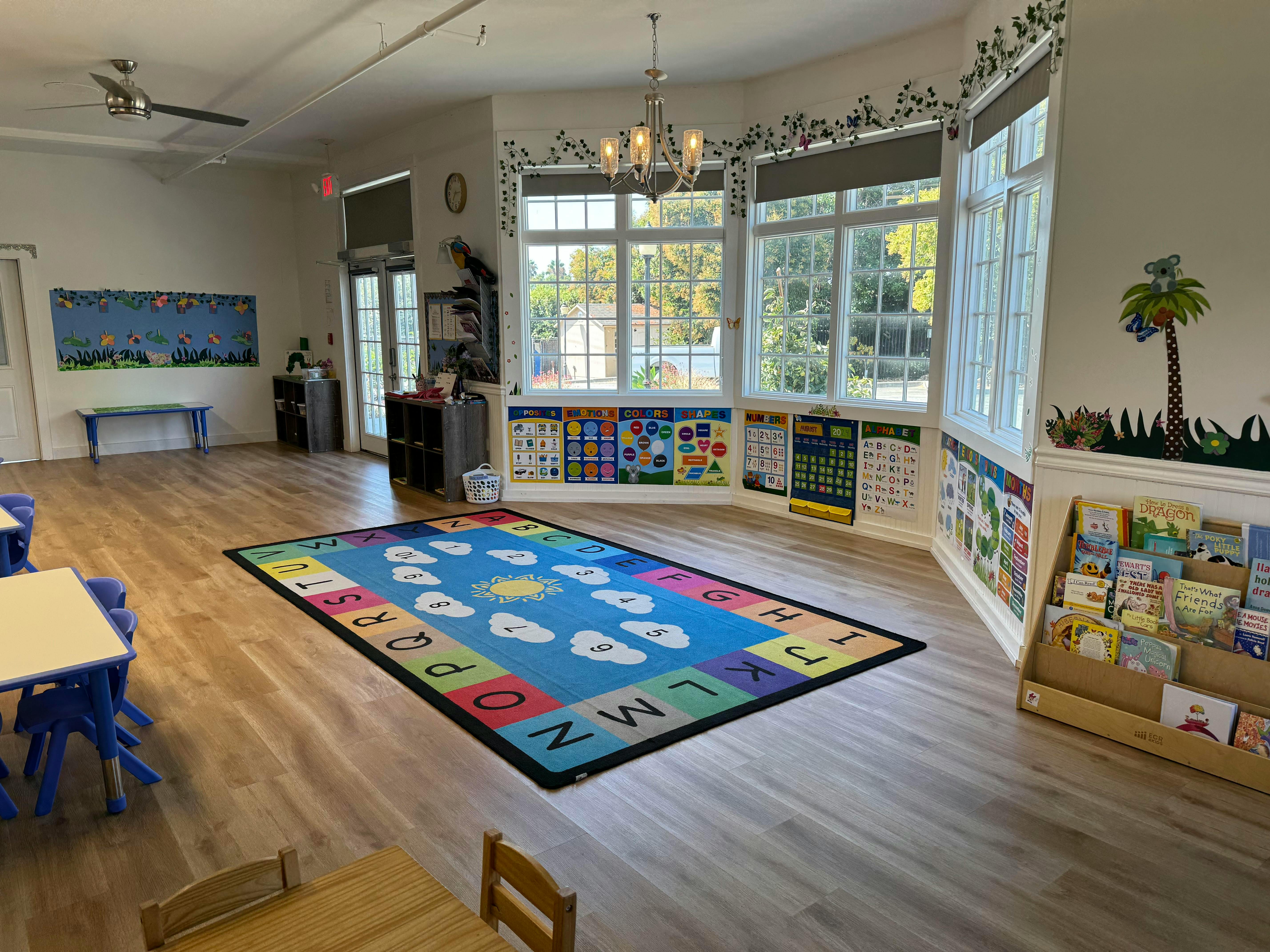 Empty classroom with an alphabet rug on the floor