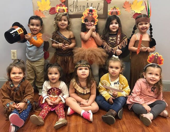 Group of children in Thanksgiving-themed costumes
